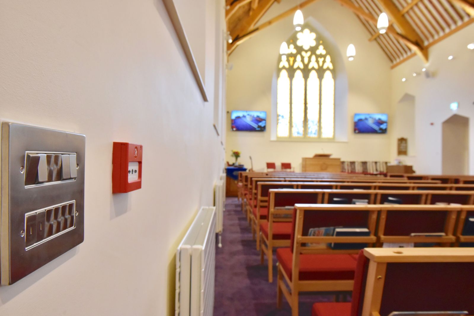 Finished switchgear, fire alarm call point and AV screens at Sion Mills Presbyterian Church